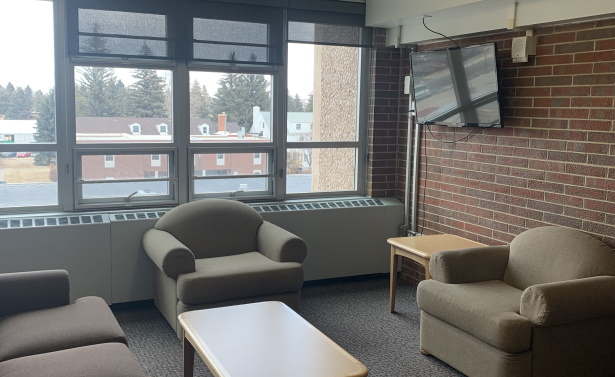 Lounge area with TV in residence hall
