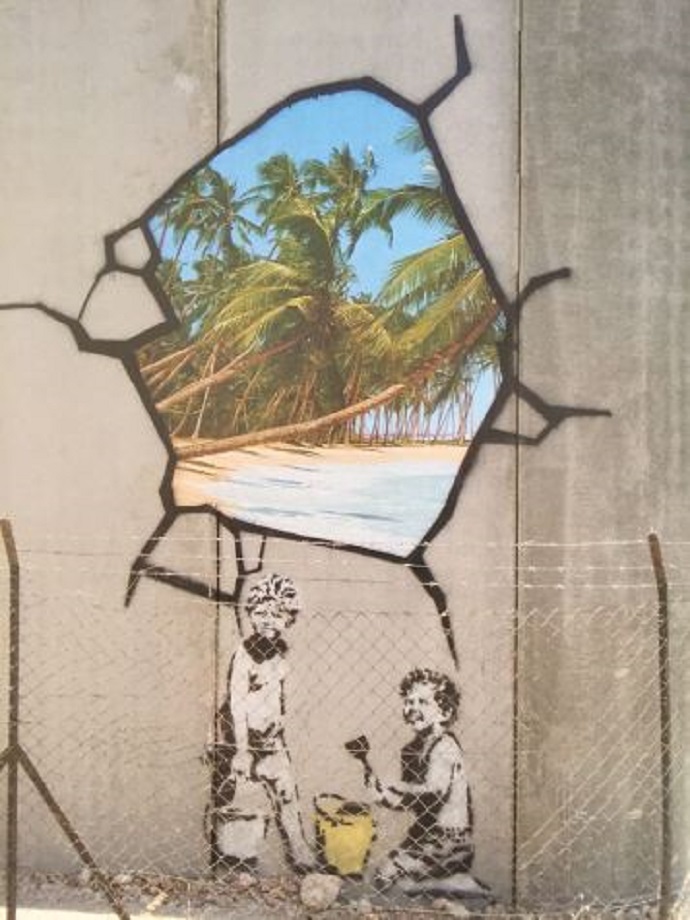 Graffiti art on a wall depicting two children