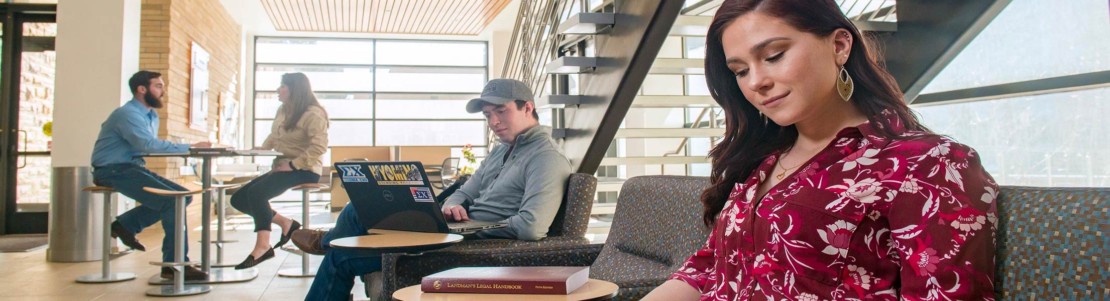 Students are studying in the UW SER building corridor.