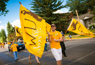 Men with flags in downtown parade.