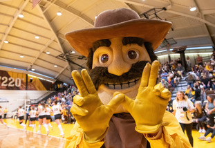 Pistol Pete throwing a UW sign