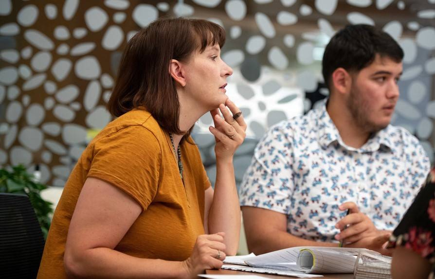 Woman listening to a discussion