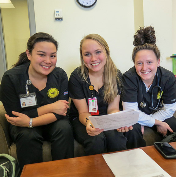 Three students in the nursing program studying for finals