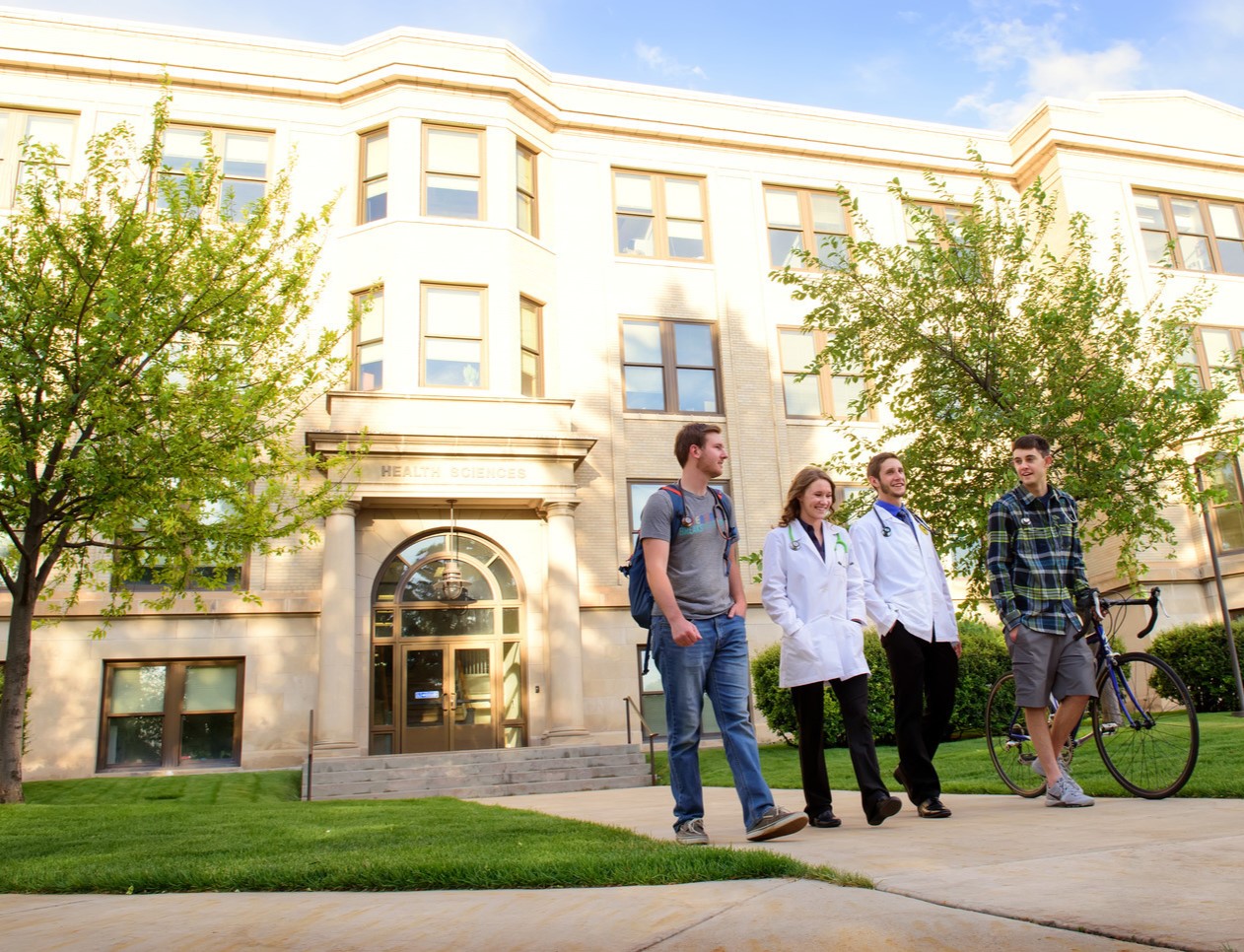Students walking outside of UW's health sciences building.