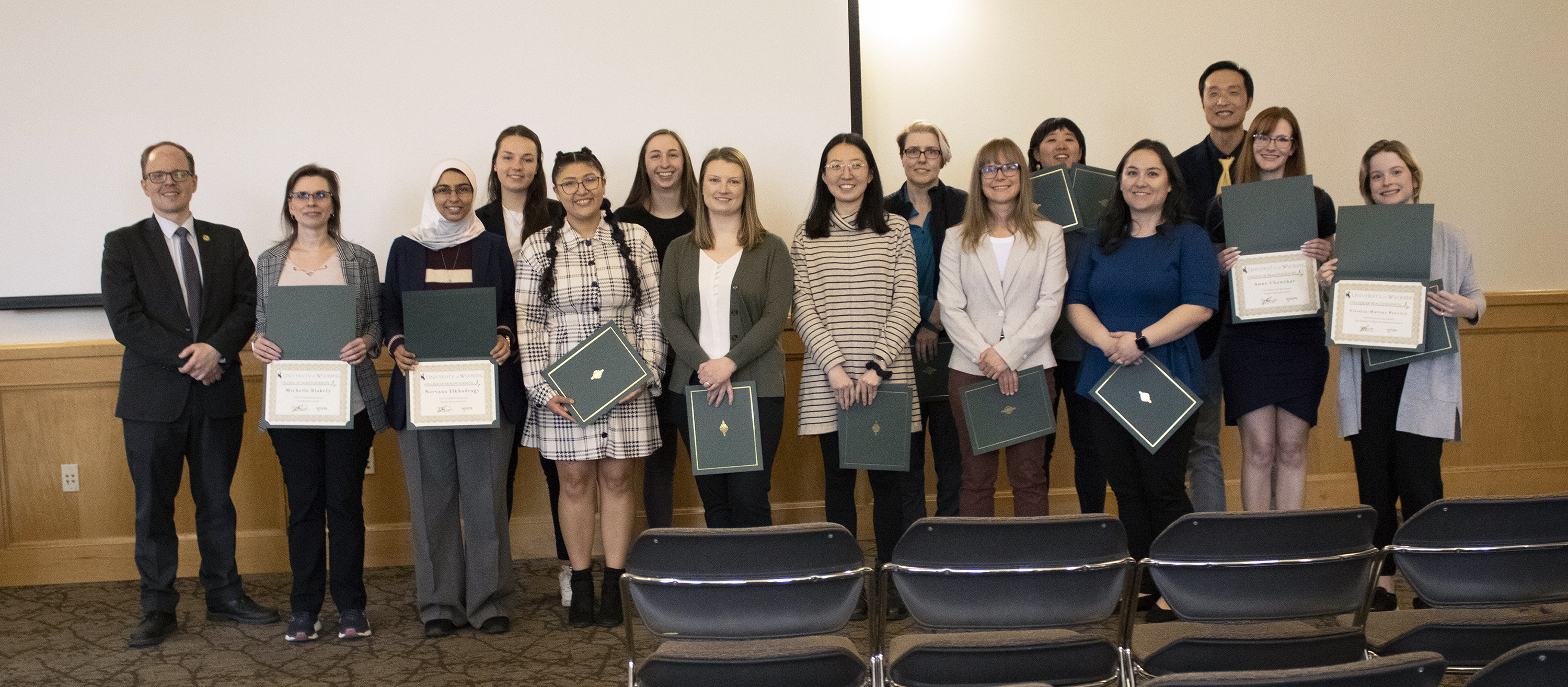 A group of faculty and students being honored for thier research.