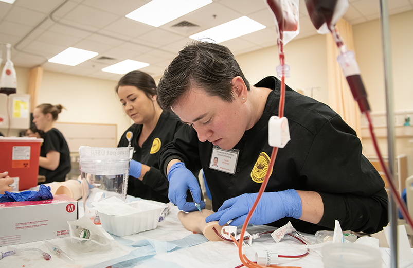 Nursing students working in a skills lab.