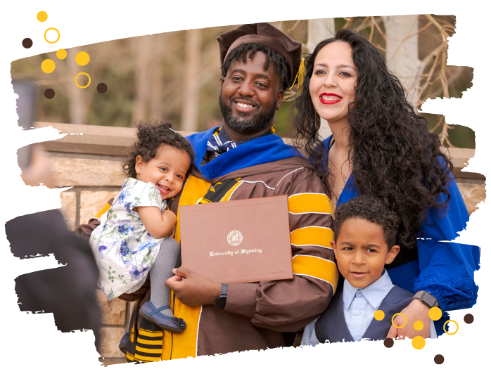 A family stands together during UW's commencement.