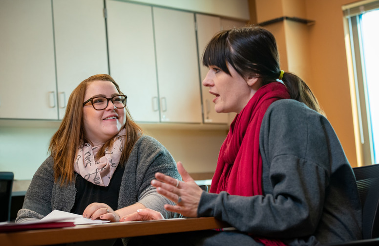 student talking with an advisor.