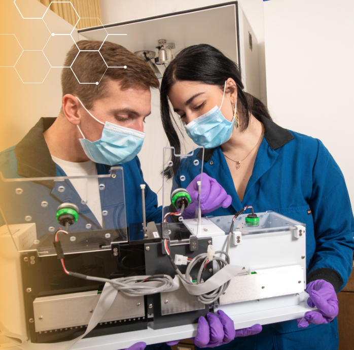 Two students working in a lab.