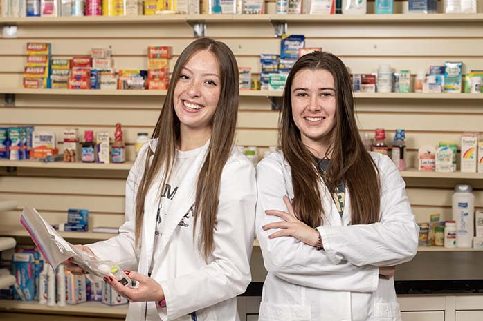 Two female pharmacy school students.