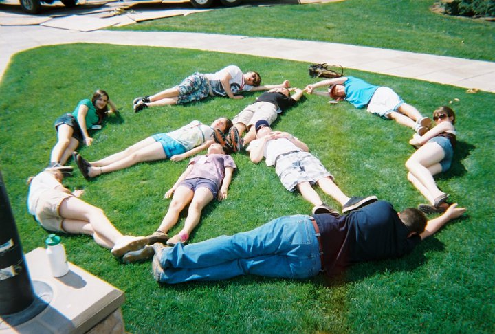 students forming a peace sign