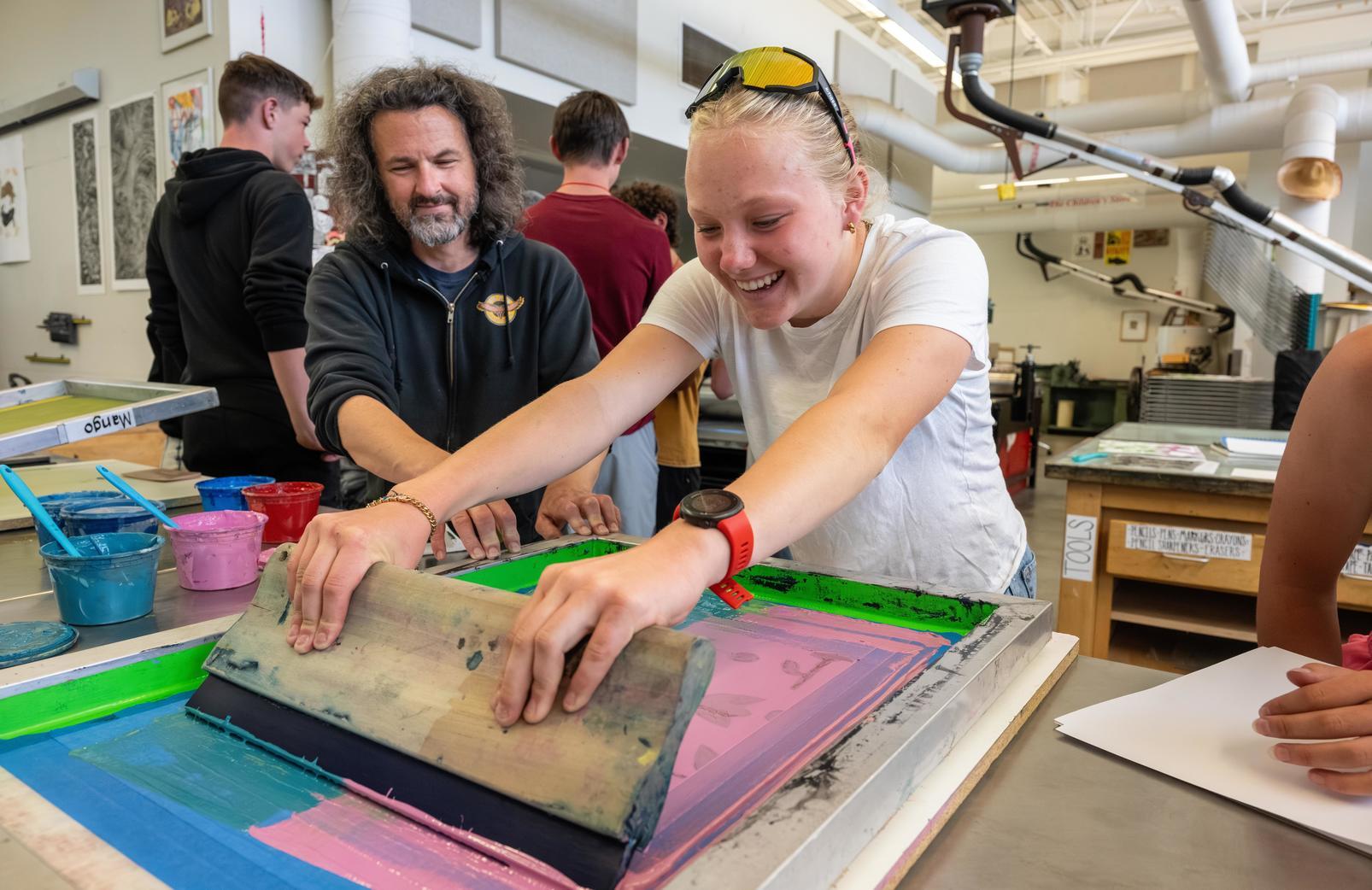 Student screen printing in their Humanities course.