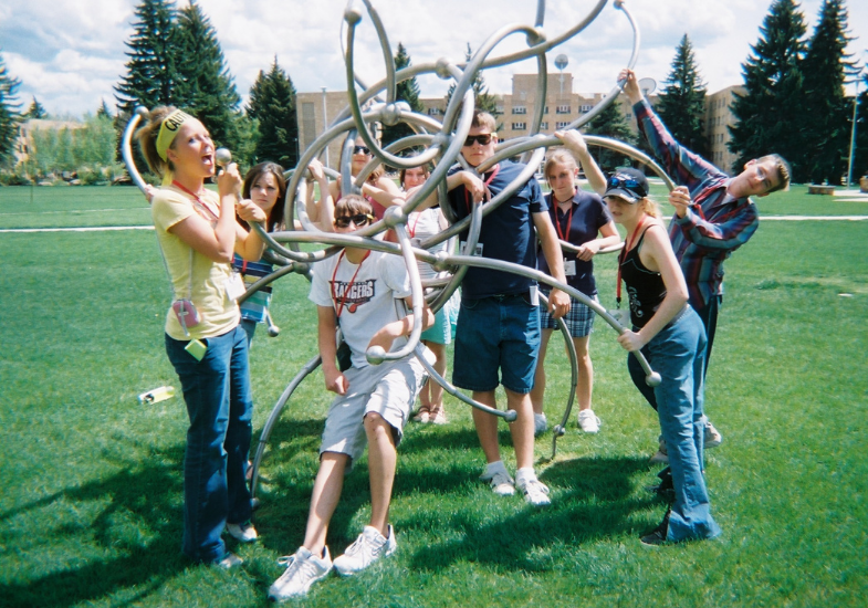 Students in Prexi's in a metal contraption.