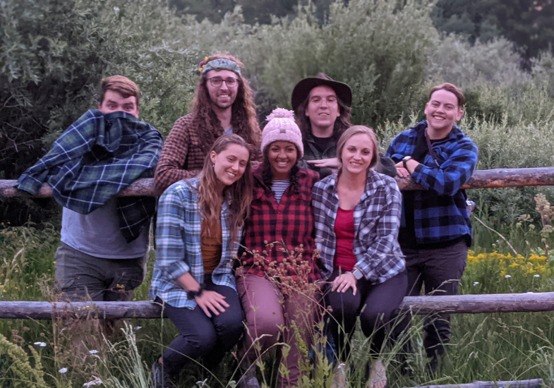 PCs sitting on a mountain fence.