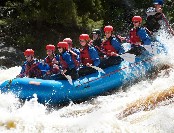 Students rafting down a river.