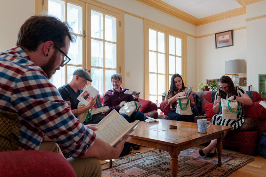 Fellows reading together inside the Cooper House