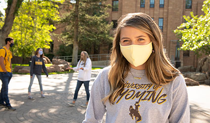 Woman in mask in front of Union