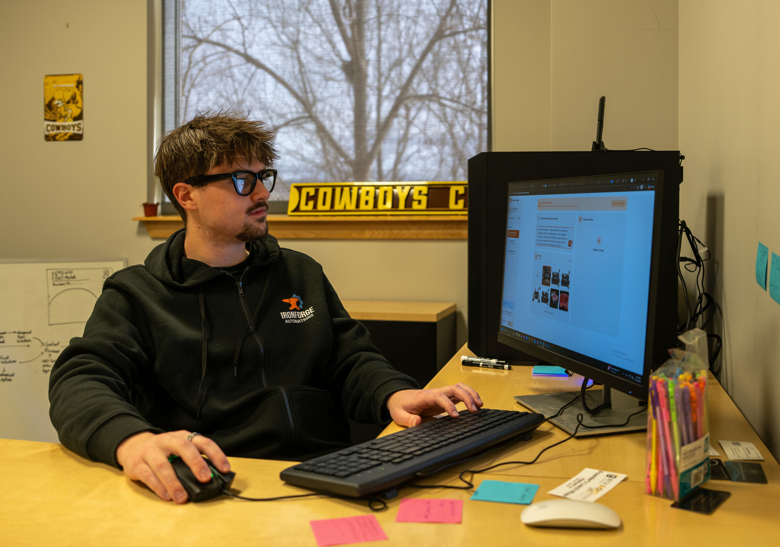 man sits at computer