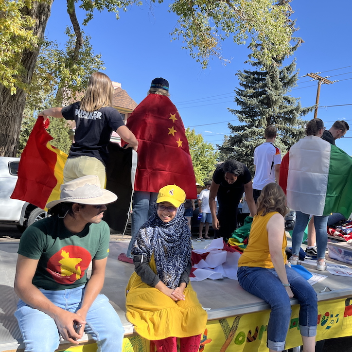 students talking on a parade float in Laramie