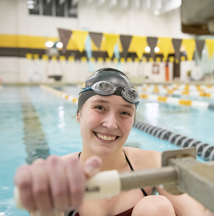 Female student in swimming pool.