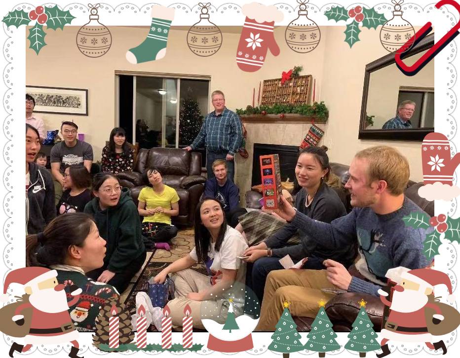 People sitting in a living room decorated for Christmas.