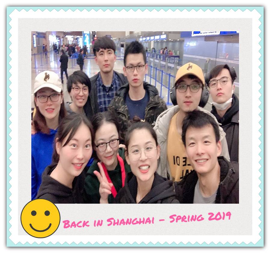 A small group of people standing in an airport.