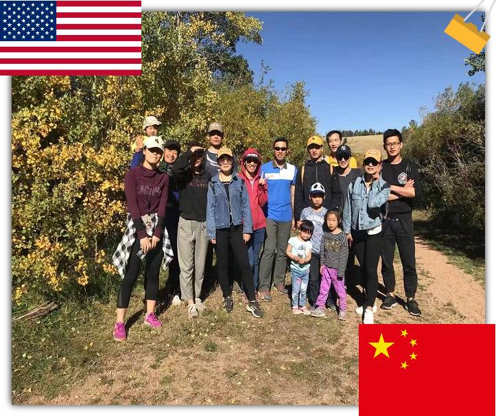 A group of people in hiking clothes, standing outside.