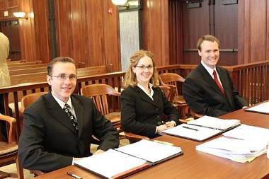 Law students in courtroom.