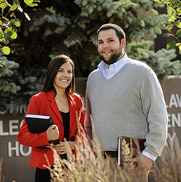 People pose outside of college of law
