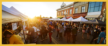 sen setting over farmers market in downtown laramie