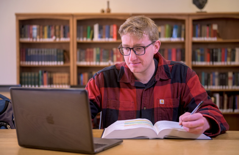 Several students study in a College of Law study space.