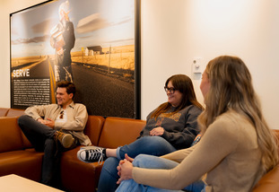 law students talk to each other in college lobby