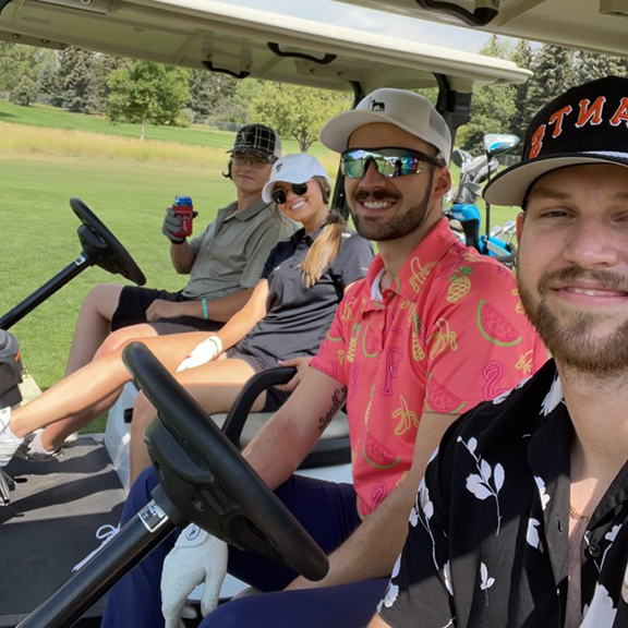 students in golf carts