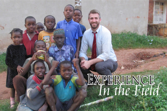 law student on international trip pictured with local children