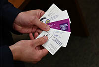 hand holding business cards