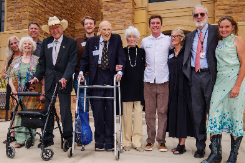 The Simpson family in front of the new law school building