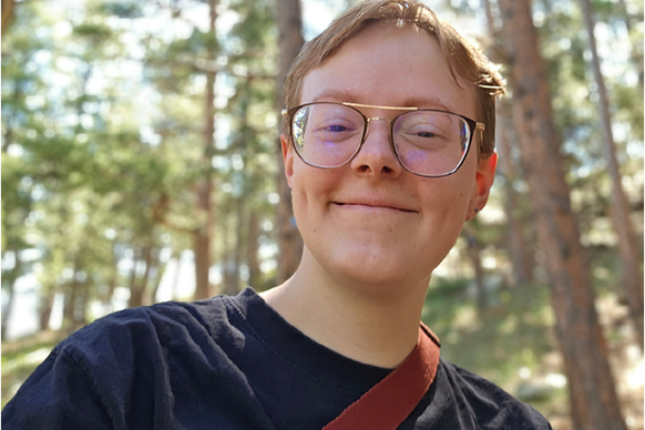 Alex Huss poses outdoors