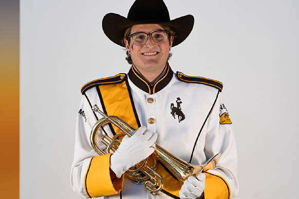 Jackson Fouras, member of Western Thunder Marching Band, poses with his mellophone