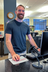 Ben at the help desk in Coe Library