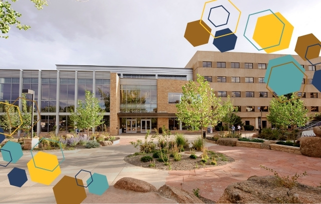 A zoomed out image of Coe Library's front exterior.