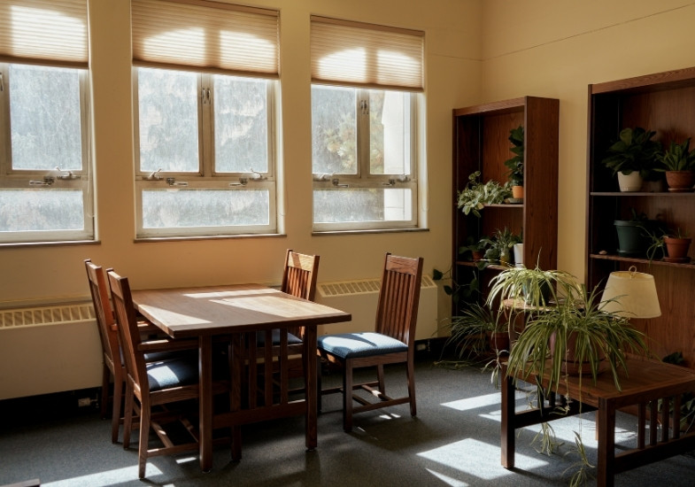 Geology Library interior with study tables and windows.