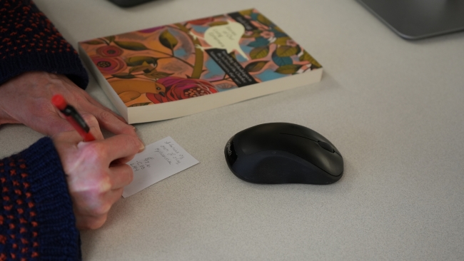 UW Libraries cataloging a book.