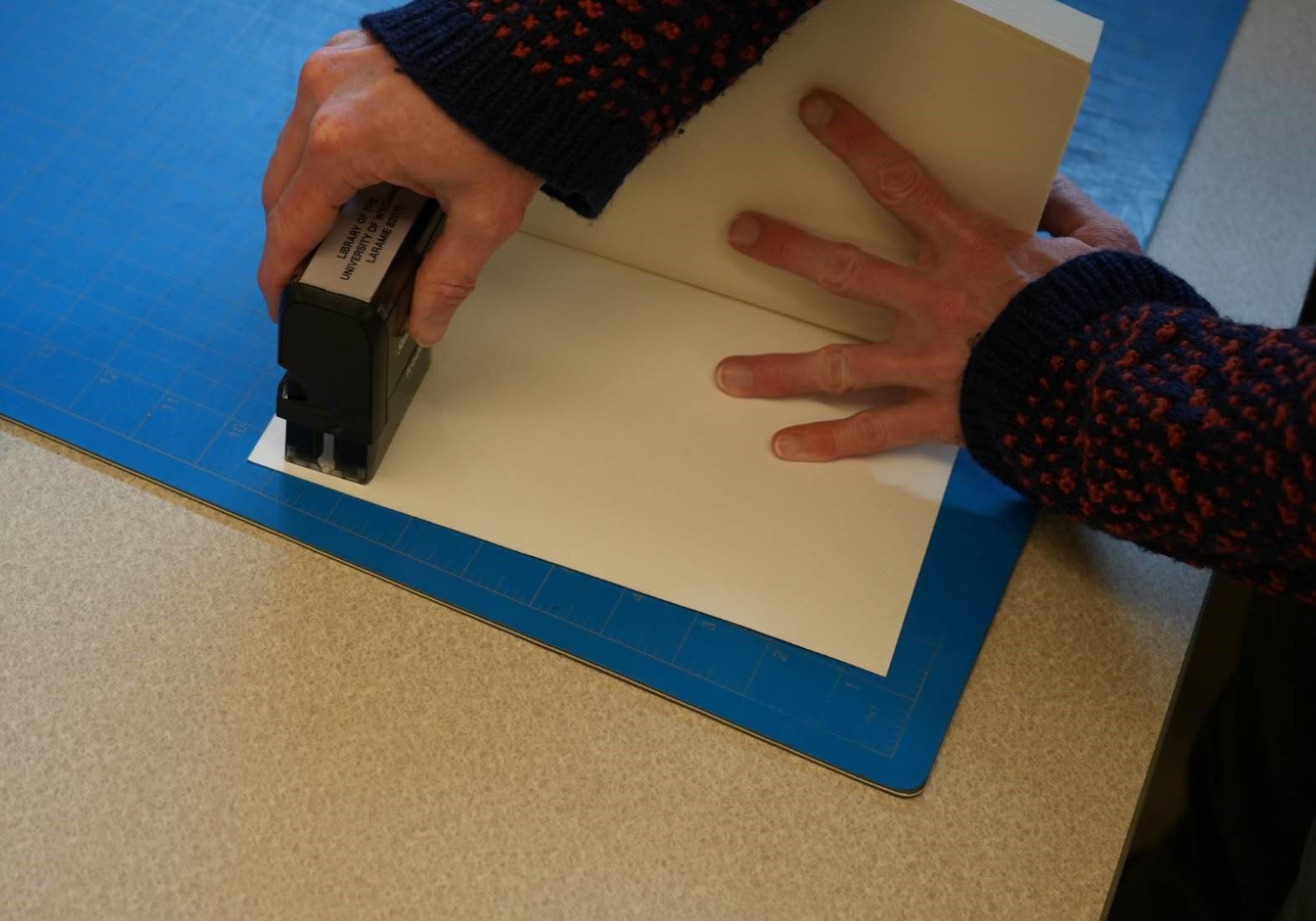 A book being stamped.