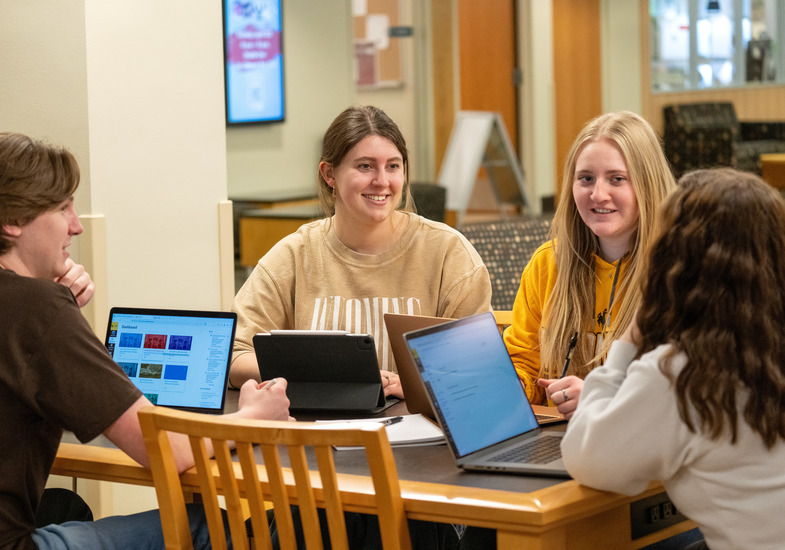 A group of students working at a table.