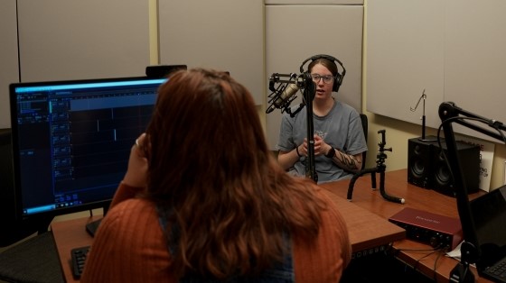 Two students using the Studio Coe Audio-Recording Space.