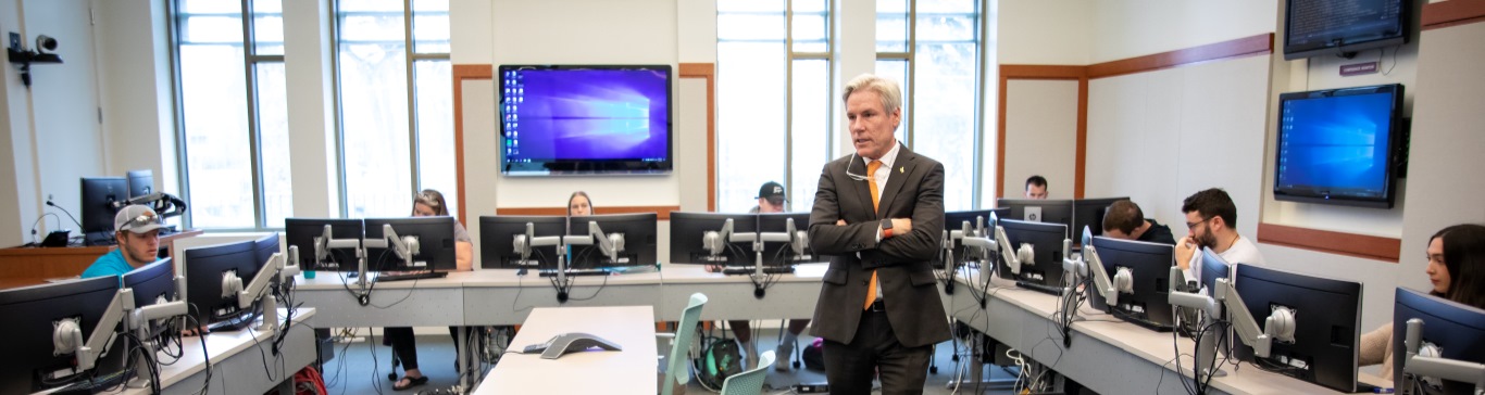 A professor lecturing in the Business building.