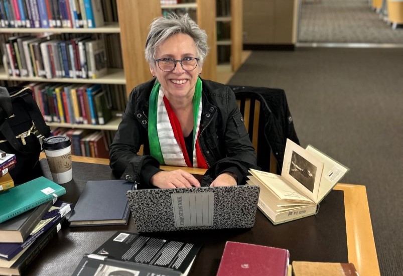 Dr. Caroline McCracken-Flesher at a table.