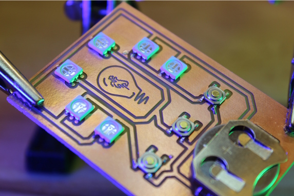 a circuit board with the UW Steamboat logo embedded on it
