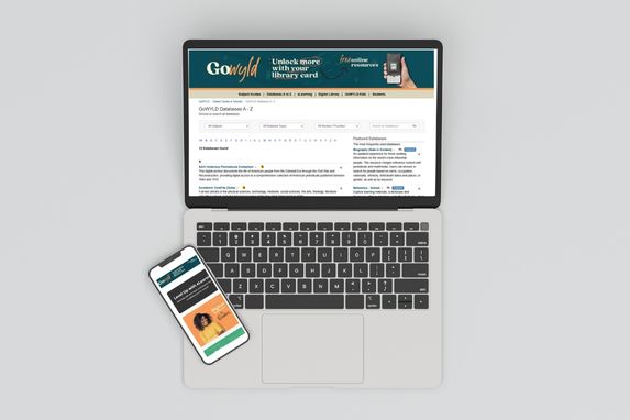 overhead shot of a laptop and cell phone with GoWyld page put on it