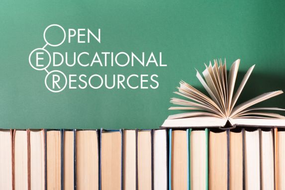 decorative image of books in a row, with a book open on top against a chalkboard. Text that reads: Open Educational Resources